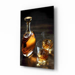 Whiskey glass wall art displayed above a leather chesterfield in a moody study with reclaimed-wood console and brass arc lamp