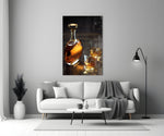 Whiskey close-up showing crystal decanter and two rocks glasses with golden ice on dark planks