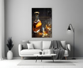 Whiskey close-up showing crystal decanter and two rocks glasses with golden ice on dark planks