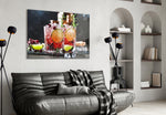 Whiskey glass wall art styled above a sideboard in a home bar