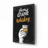 Whiskey glass wall art displayed above a leather chesterfield in a moody man cave with reclaimed-wood console and brass arc lamp