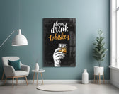 Whiskey glass wall art styled above a sideboard in a home bar