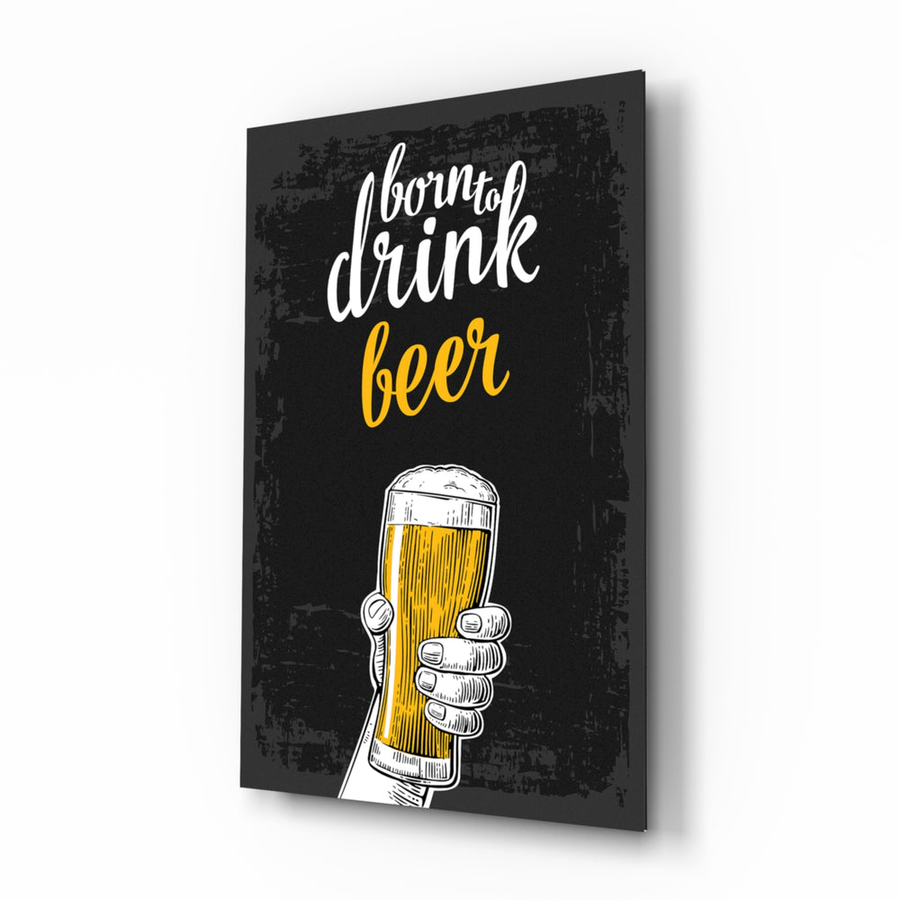 Beer glass wall art displayed above a leather chesterfield in a moody man cave with reclaimed-wood console and brass arc lamp