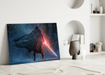 Lightsaber close-up showing hooded Sith with crimson lightsaber in snow forest