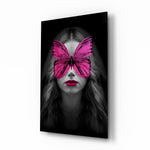 Butterfly Eyes glass wall art displayed above a velvet bed in a moody bedroom with rattan nightstands and brushed-brass sconces