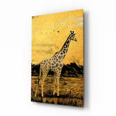 Giraffe glass wall art displayed above a linen sofa in a warm safari lounge with rattan armchair and brass picture light