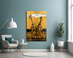 Giraffes glass wall art styled above a bed in a bedroom