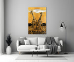 Giraffes close-up showing symmetric pair on textured gold-leaf horizon
