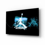 Michael Jordan glass wall art displayed above a black leather sectional in a moody man cave with neon LED strip and matte-black coffee table