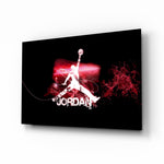 Michael Jordan glass wall art displayed above a black leather sectional in a moody man cave with neon LED strip and matte-black coffee table
