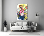 Harley Quinn close-up showing slyly smiling face with magenta-lime pigtails and confetti mallet