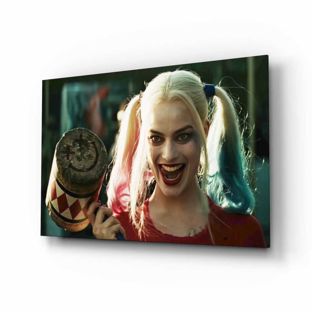 Harley Quinn glass wall art displayed above a velvet sofa in a moody teen lounge with brass arc lamp and matte-black coffee table