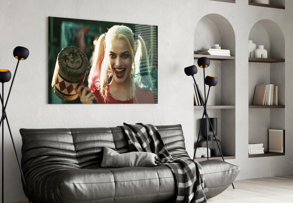 Harley Quinn glass wall art styled above a console in a hallway