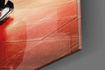 Ferrari FXX K artwork anchoring a wall with warm luxe palette