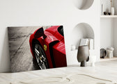 Ferrari FXX K close-up showing rain-spattered crimson hood with prancing horse shield