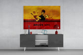 Bruce Lee panel catching directional light to reveal its electric reverence