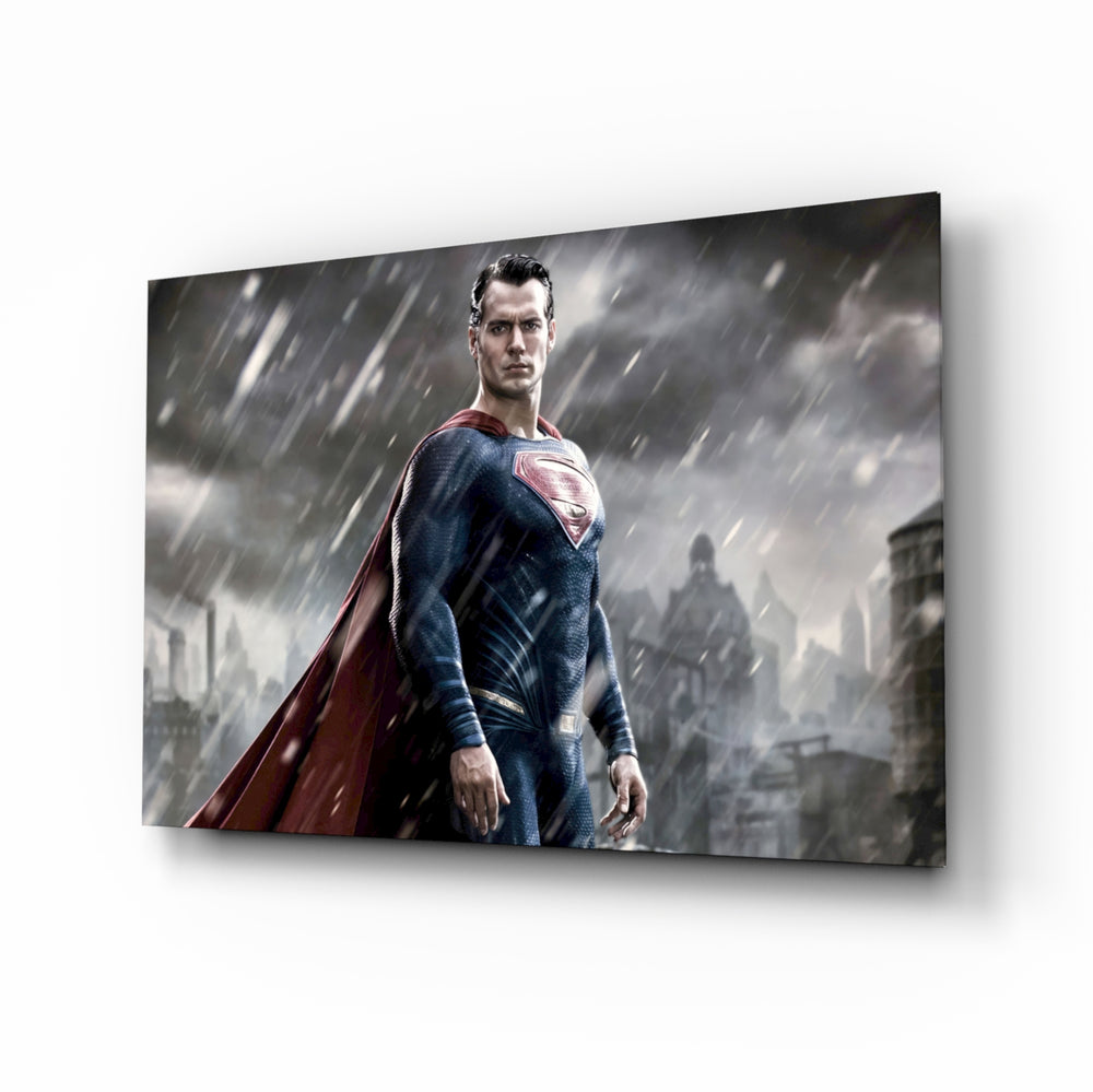Superman glass wall art displayed above a leather chesterfield in a moody man cave with reclaimed-wood console and brass arc lamp
