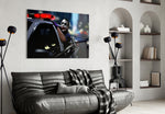 Joker glass wall art styled above a console in a gaming room