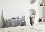Wanderlust close-up showing flowing cursive across NYC monochrome skyline
