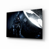 Batman Call glass wall art displayed above a black leather sectional in a moody home theater with brass arc lamp and reclaimed-wood console