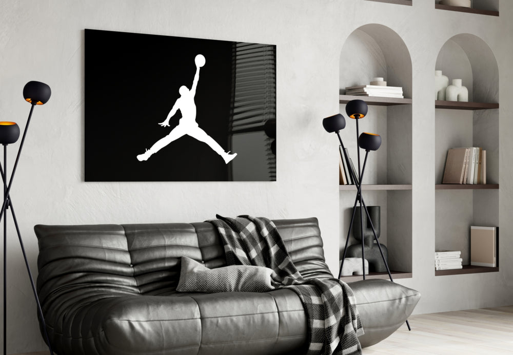 Air Jordan glass wall art styled above a console in a sneaker closet