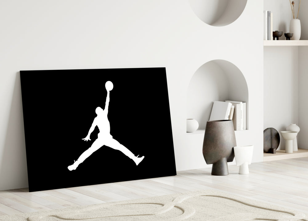 Air Jordan close-up showing Jumpman silhouette in ivory on pure onyx