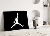 Air Jordan close-up showing Jumpman silhouette in ivory on pure onyx