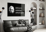 Einstein glass wall art styled above a desk in a study