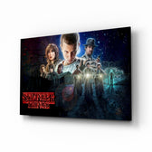 Stranger Things Poster glass wall art displayed above a velvet sofa in a moody teen lounge with neon LED strip and matte-black coffee table