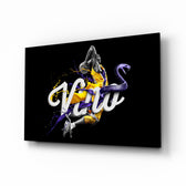 Los Angeles Lakers glass wall art displayed above a leather chesterfield in a moody man cave with reclaimed-wood console and brass arc lamp