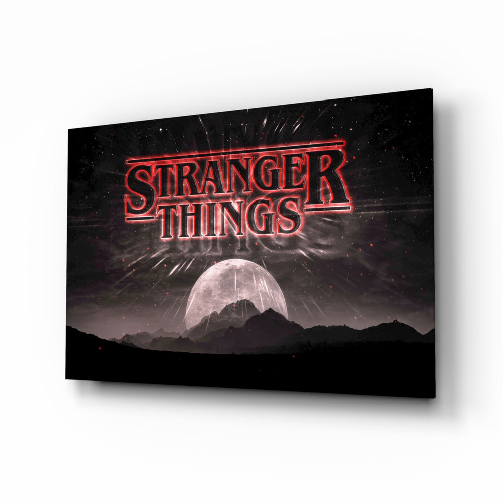 Stranger Things glass wall art displayed above a velvet sofa in a moody teen lounge with neon LED strip and matte-black coffee table