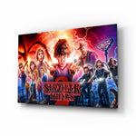 Stranger Things Poster glass wall art displayed above a velvet sofa in a moody teen lounge with neon LED strip and matte-black coffee table