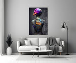 Mutation glass wall art styled above a bed in a bedroom