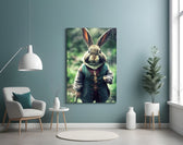 The Rabbit glass wall art styled above a console in a hallway