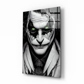 Joker glass wall art displayed above a black leather sectional in a moody home theater with blackout drapes