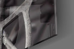Future Human artwork anchoring a wall with bold monochrome palette