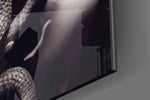 Medusa artwork anchoring a wall with bold dramatic palette