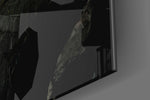 Slit artwork anchoring a wall with bold dramatic palette