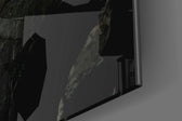 Slit artwork anchoring a wall with bold dramatic palette