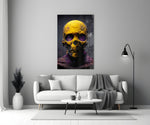 Skull close-up showing gold leaf cranium and violet-stained sockets