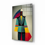 Colored Man glass wall art displayed above a walnut console in a contemporary hallway with brass sconces and a leather chair