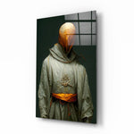 Headless Monk glass wall art displayed above a walnut console in a moody hallway with brass sconces