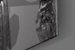 Humachine artwork anchoring a wall with bold monochrome palette