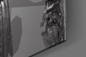 Humachine artwork anchoring a wall with bold monochrome palette
