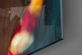 Beauty artwork anchoring a wall with warm dramatic palette
