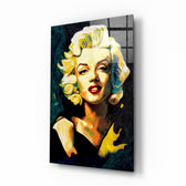 Marilyn Monroe glass wall art displayed above a walnut headboard in a serene bedroom with linen drapes and a brass lamp