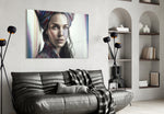 Girl with a Tattoo glass wall art styled above a sideboard in a living room