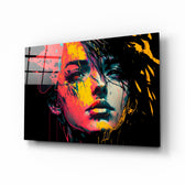 Rebel Beauty glass wall art displayed above a desk in a moody teen lounge with magenta and saffron LED accents