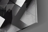 Cubic artwork anchoring a wall with bold monochrome palette