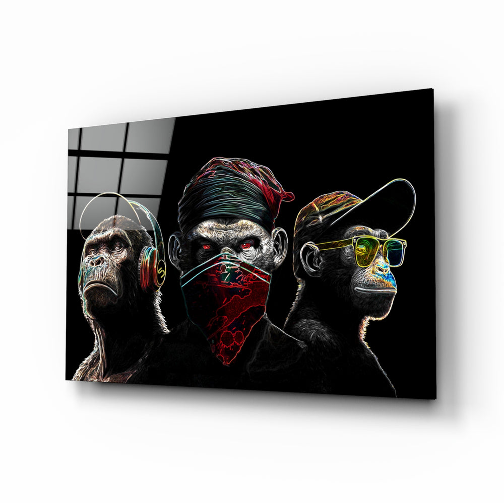 3 Wise Monkeys Neon Lines glass wall art displayed above a black desk in a moody gaming room with neon LED strips
